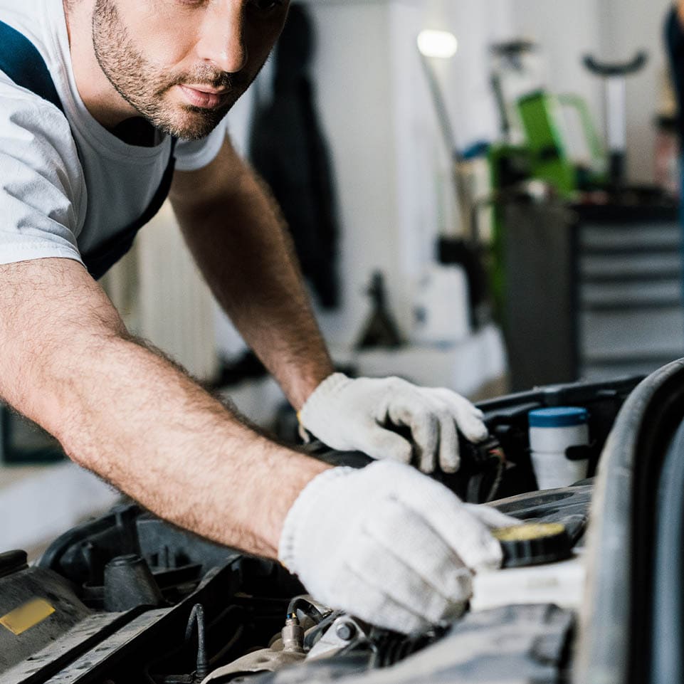 Mechanic-Working-On-Car